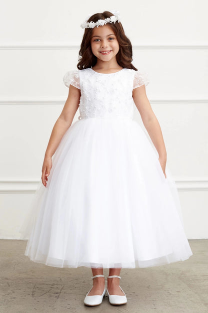Gauzy tulle ends in a fine, sheer hem on the off-white flower girl dress.