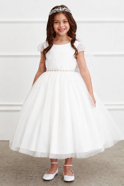 A jeweled belt separates the off-white flower girl dress's plain bodice.