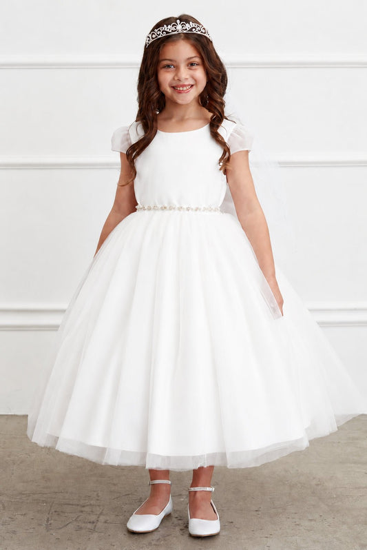 A jeweled belt separates the off-white flower girl dress's plain bodice.