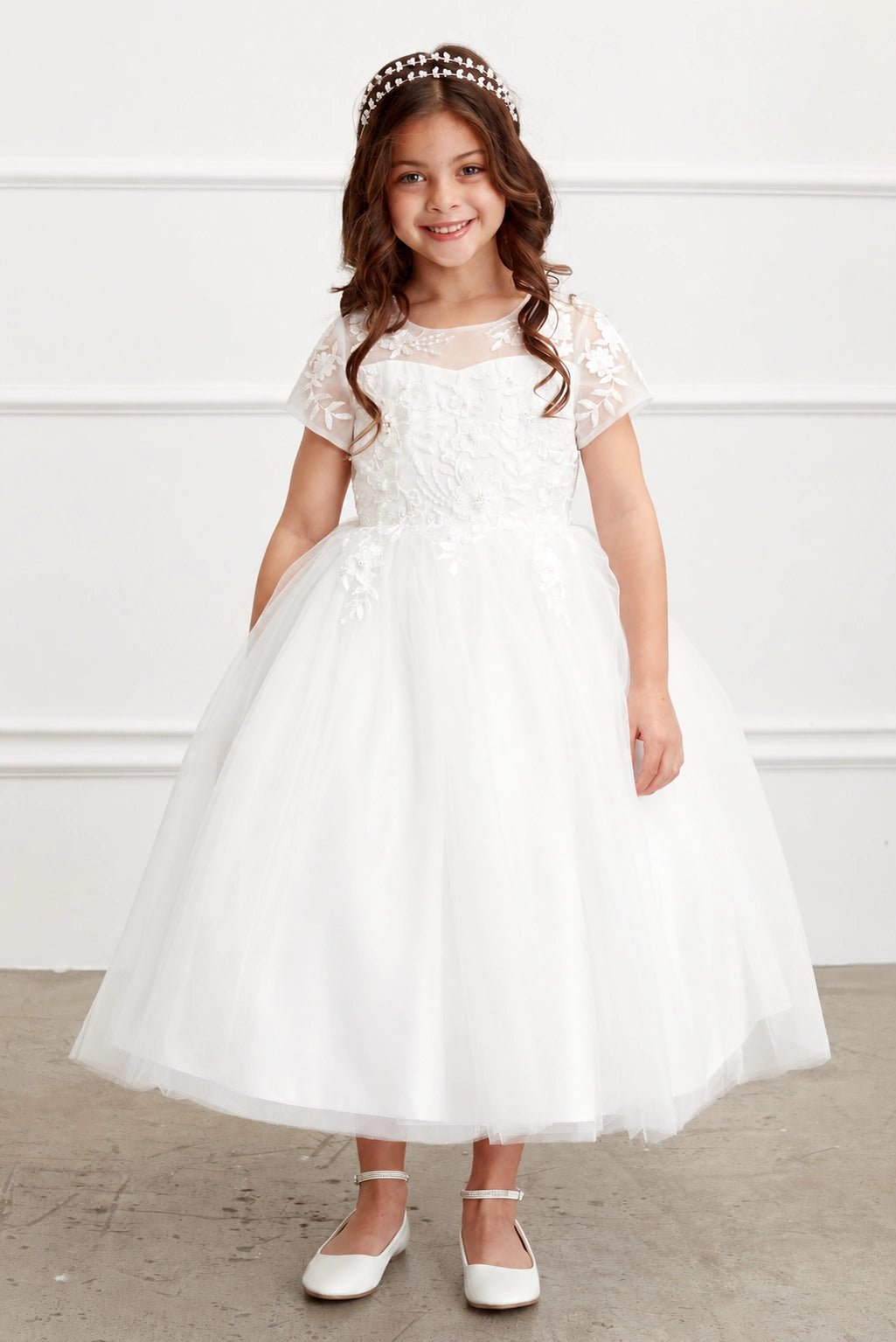 Off-White flower girl dress detailed with lace cap sleeves.