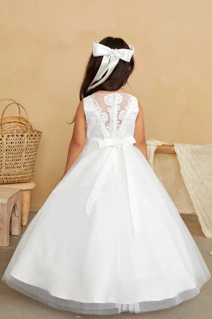 Leafy embroidery descends the off-white flower girl dress's sheer back.