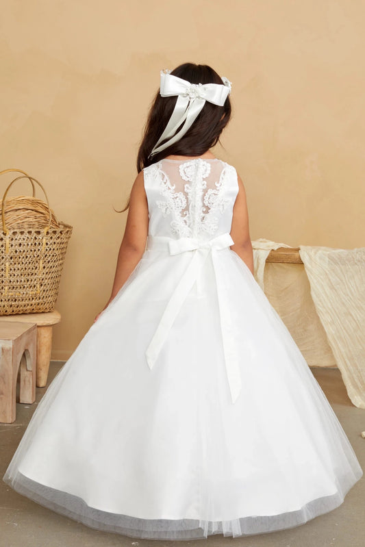 Leafy embroidery descends the off-white flower girl dress's sheer back.