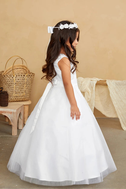 Off-white flower girl dress shown with a crisp, ribbon-trimmed skirt edge.