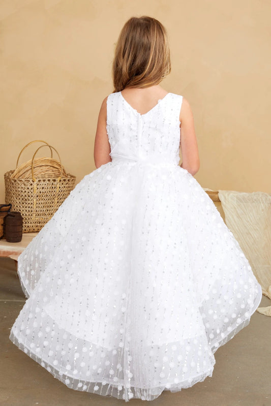 This white flower girl dress displays a high-low back hem.