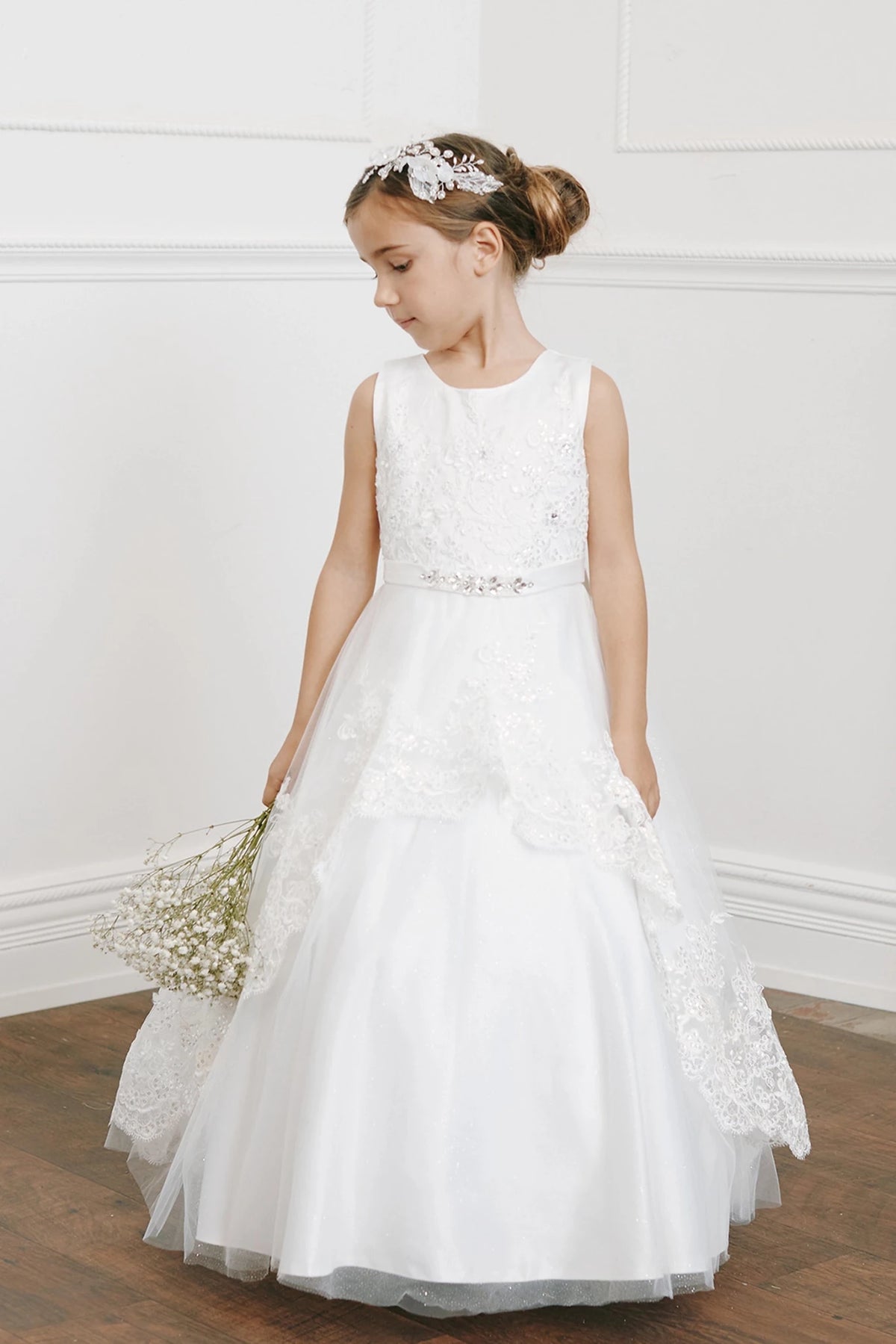 Side view of the ivory sequin lace with a tulle peplum flower girl dress.
