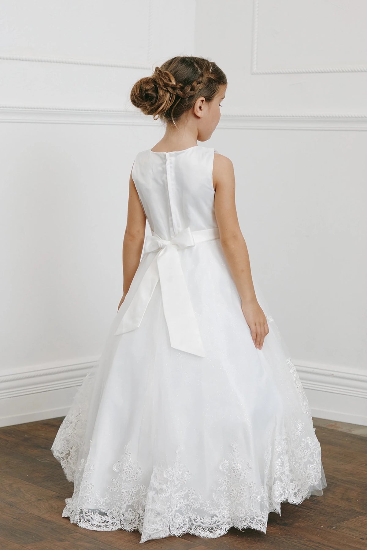 Back view of the ivory sequin lace with a tulle peplum flower girl dress.