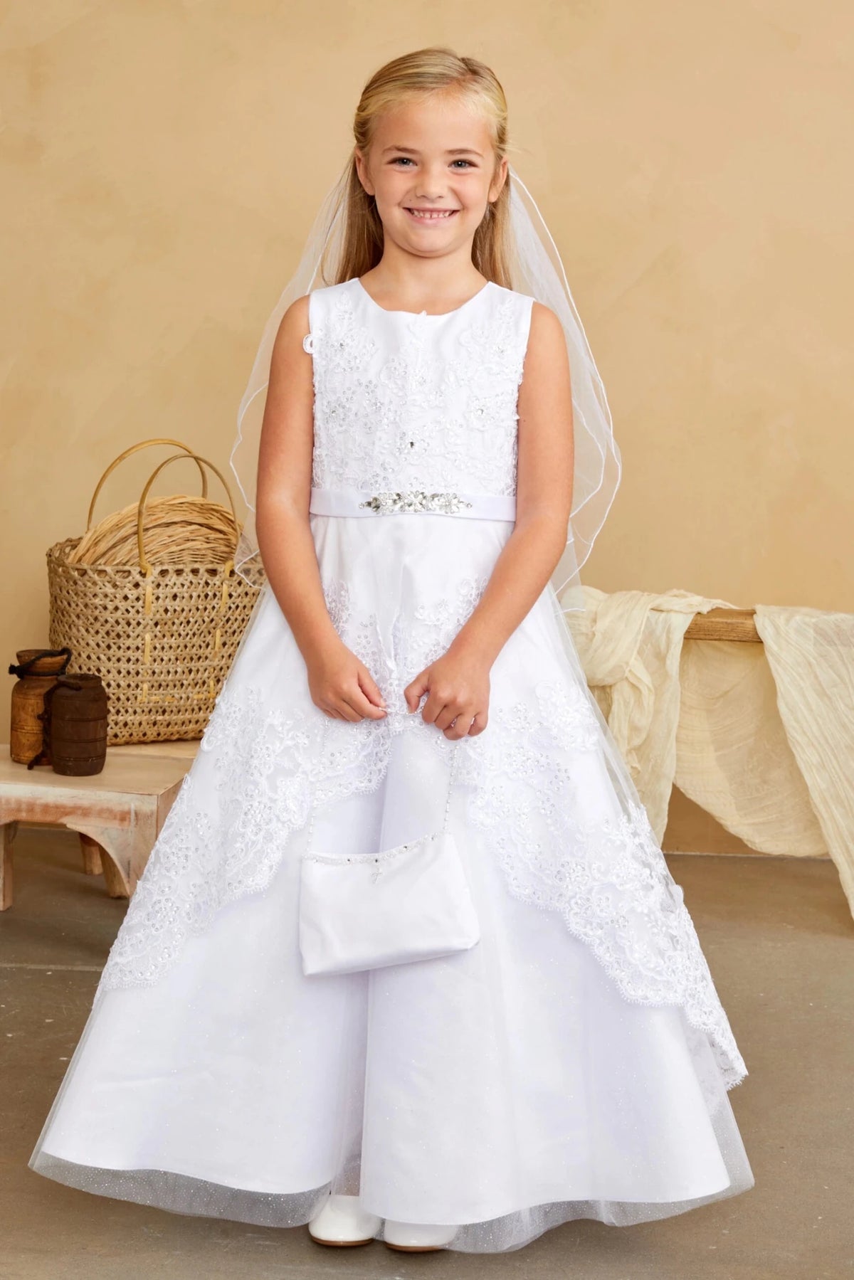 Embroidered skirt panels on a white flower girl dress.
