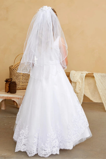 With a lace-edged back train, a white flower girl dress.