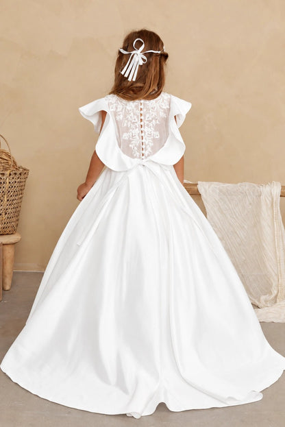 Beneath the lace back, off-white flower girl dress fabric forms a broad bow.