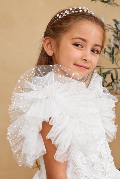 This off-white flower girl dress displays pleated shoulder ruffles.