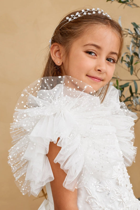 This off-white flower girl dress displays pleated shoulder ruffles.