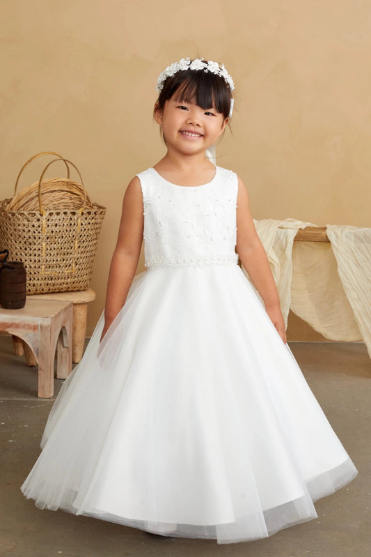 Scattered beads decorate the off-white flower girl dress's plain bodice.