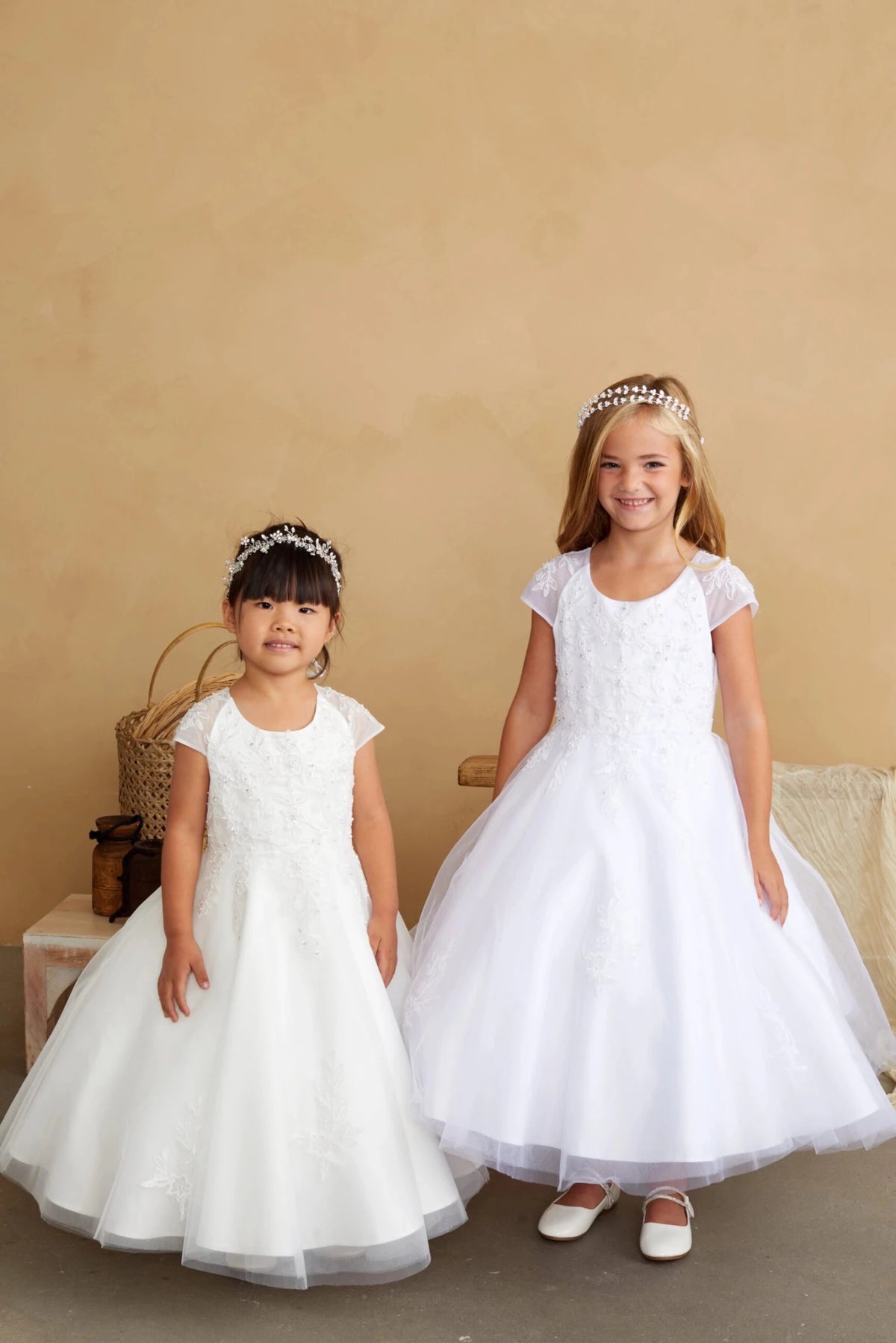 Front view of the ivory corded lace with illusion short sleeves flower girl dress.
