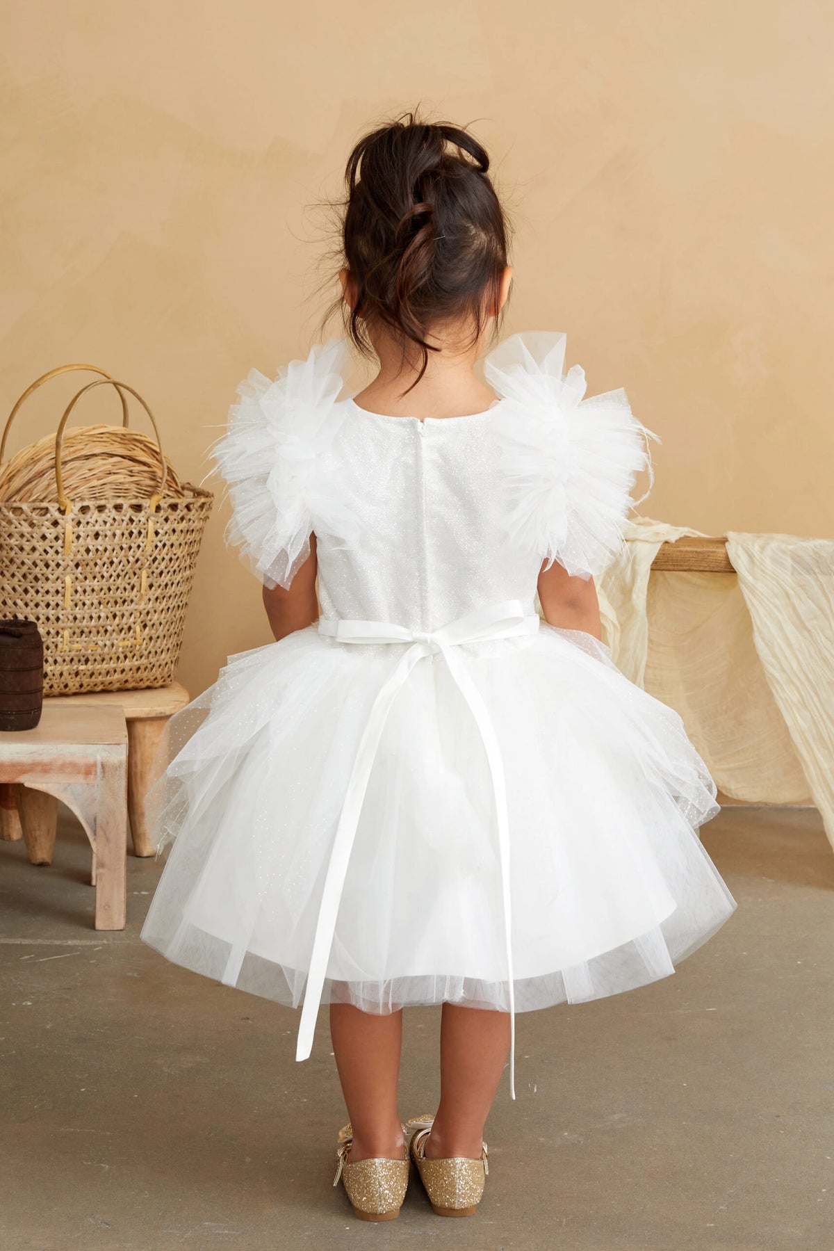 The Ivory kids pageant dress has a tied sash across the back waist.