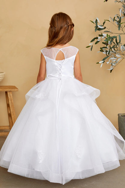 With an oversized back bow, a white flower girl dress.