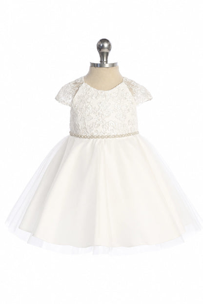 The off-white flower girl dress features lace cap sleeves.