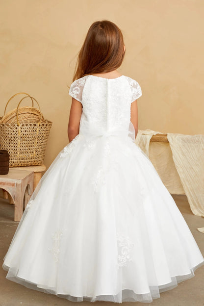 At the back, an off-white flower girl dress has a small satin waist bow.