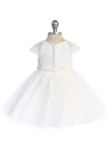 White flower girl dress with a sheer back neckline.
