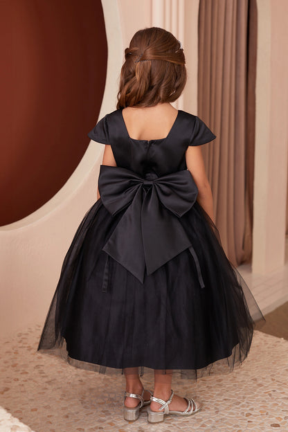 The Black kids pageant dress has a large satin bow and square back neckline.