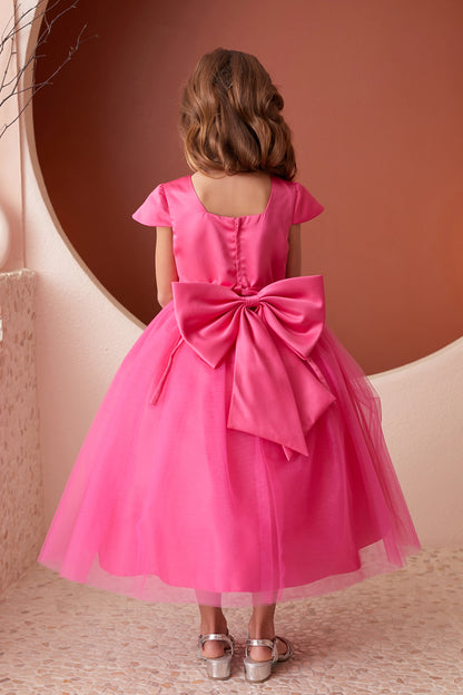 The Fuchsia kids pageant dress has a large satin bow and square back neckline.