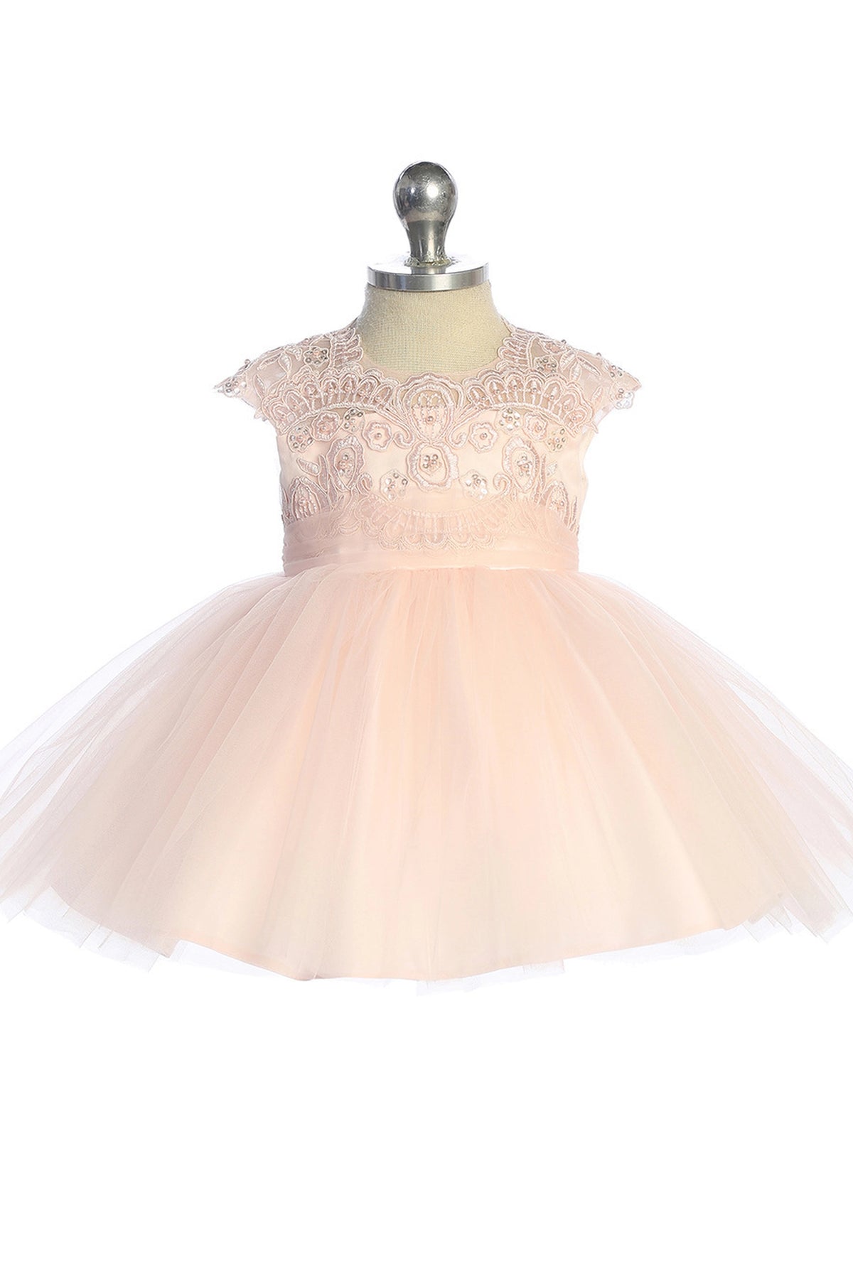 Scalloped lace neckline on a blush flower girl dress.