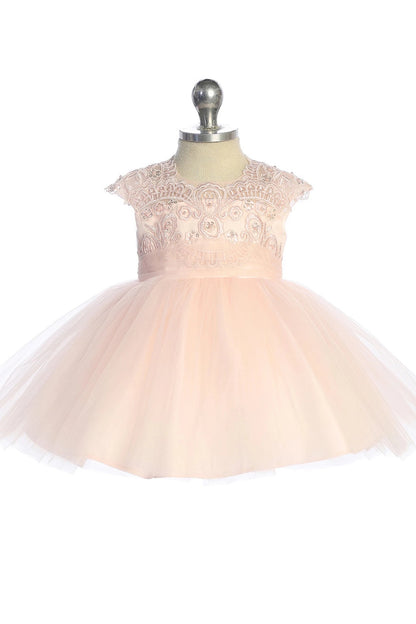 Scalloped lace neckline on a blush flower girl dress.