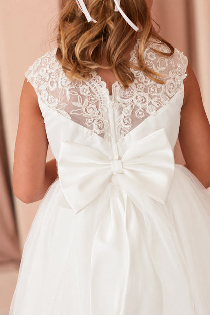 Featuring sheer embroidered back, an off-white flower girl dress.