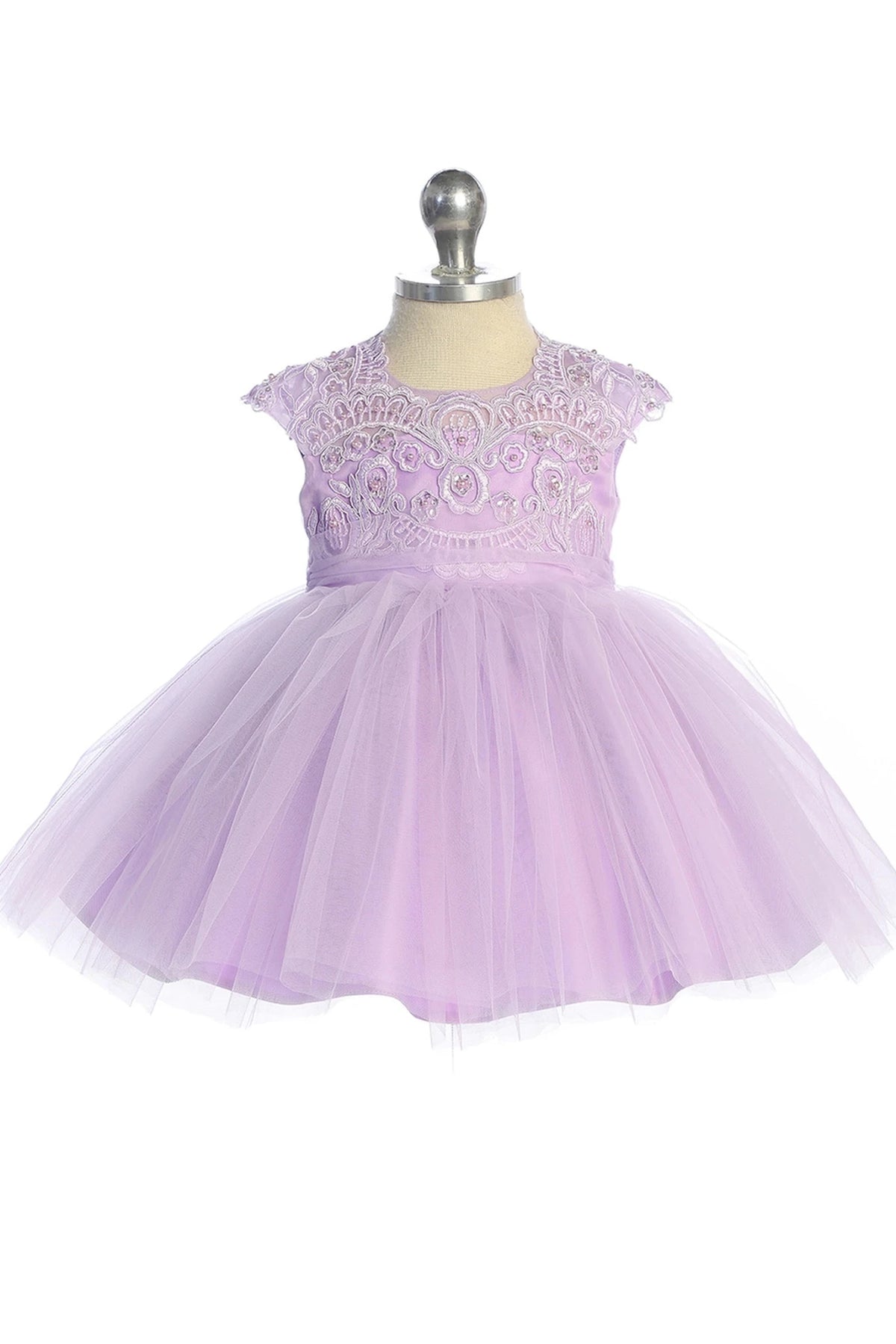 On this lilac flower girl dress, a scalloped neckline is visible.