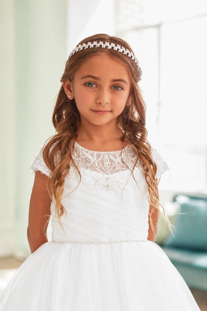 Looping lace decorates the off-white flower girl dress's sheer neckline.