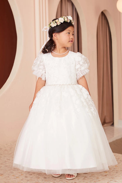 Floral lace falls over the hips of this off-white flower girl dress.