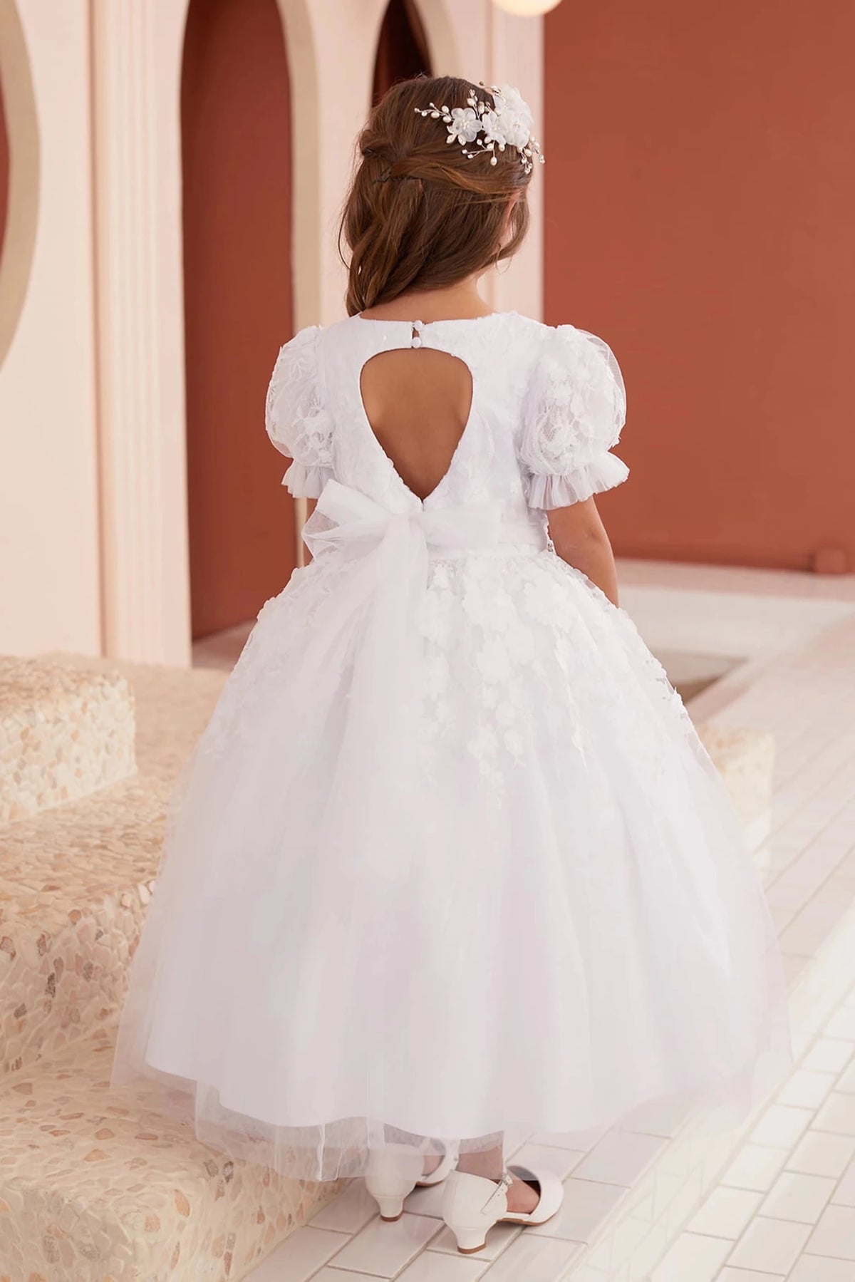 White flower girl dress with open keyhole back.