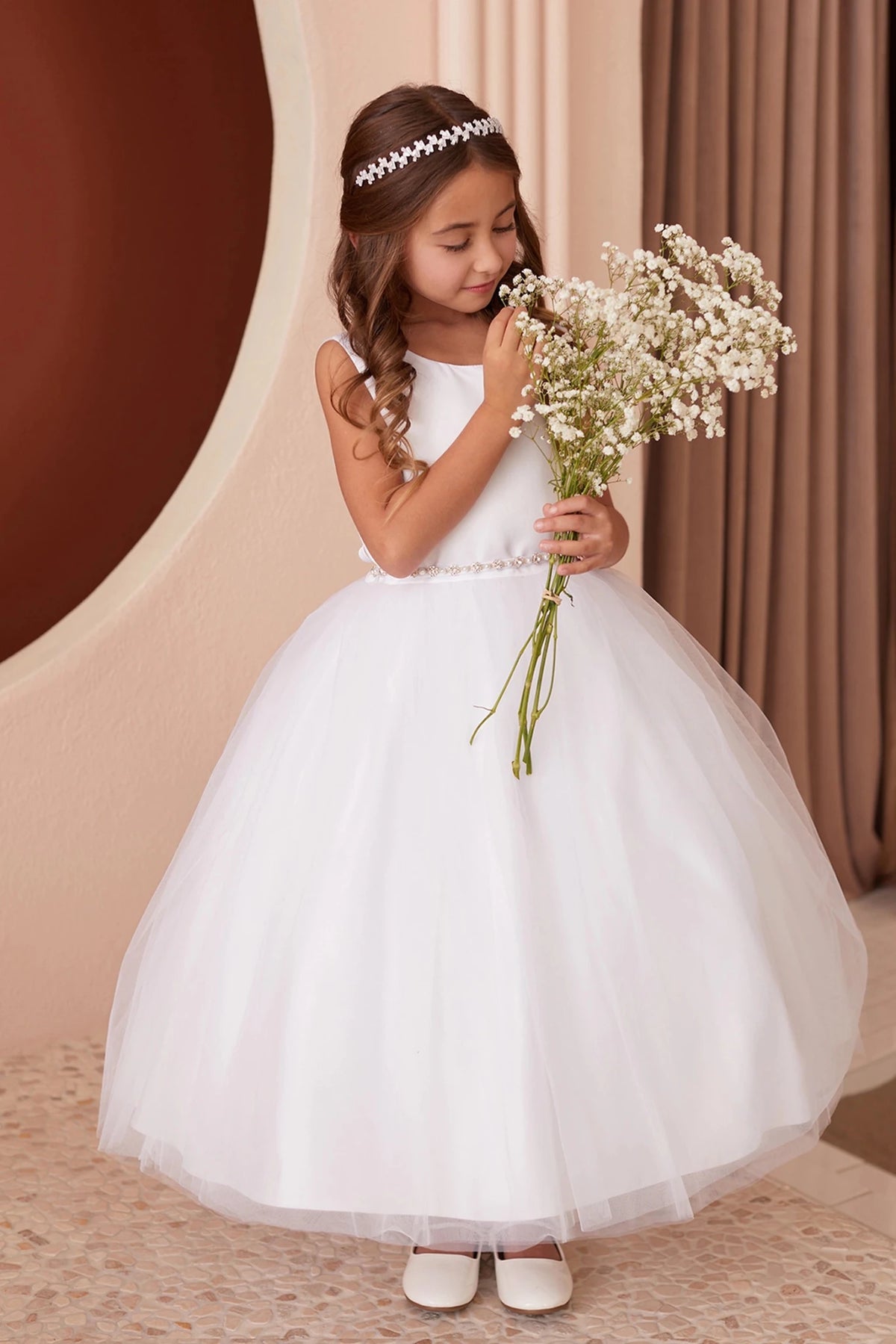Full gathered skirt shown on the white flower girl dress.