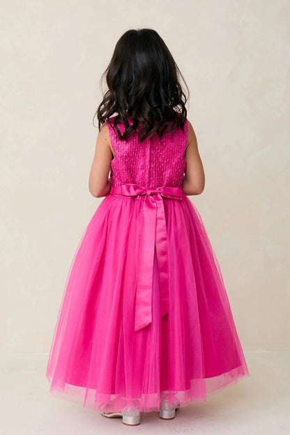 Fuchsia flower girl dress featuring a long satin back ribbon.