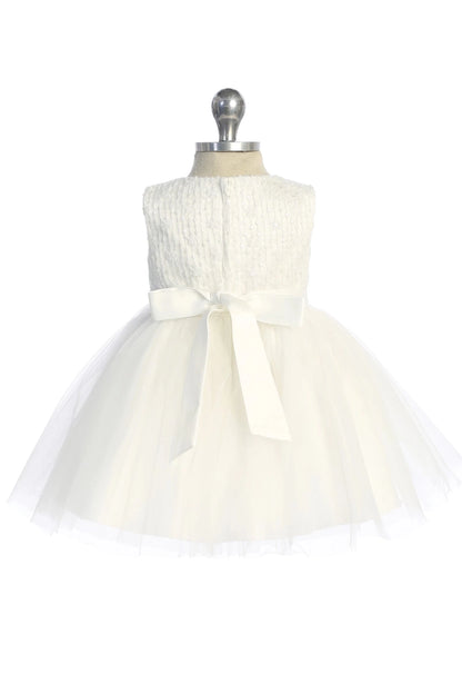 Ribbon bow centered on the back of an off-white flower girl dress.