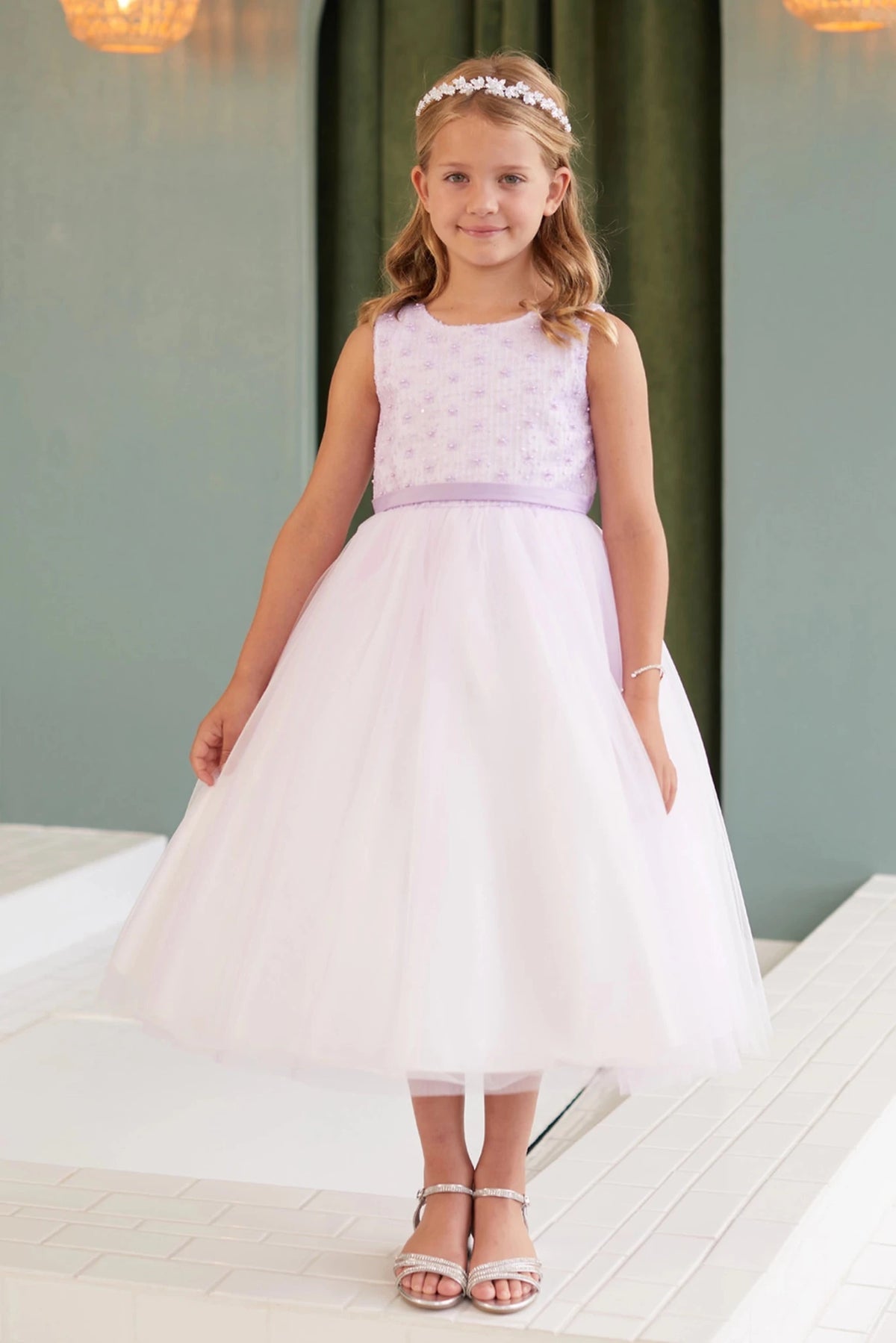 Beaded bodice pattern is visible on the lilac flower girl dress.