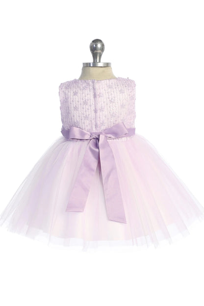 Lilac flower girl dress detailed with a long satin sash.