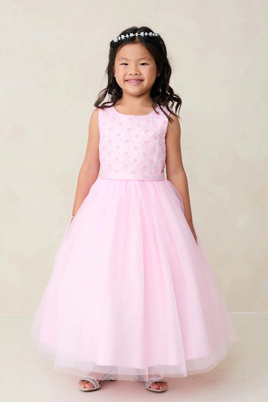 Defined by a lace-covered bodice, this pink flower girl dress.