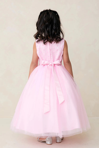 With satin ribbon tails, a pink flower girl dress.