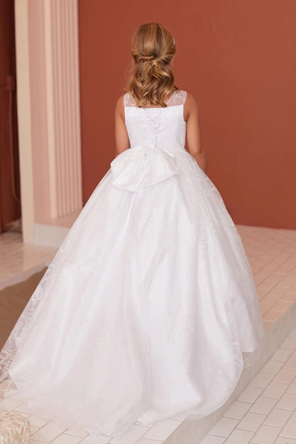 Lacing runs down the back of this off-white flower girl dress.