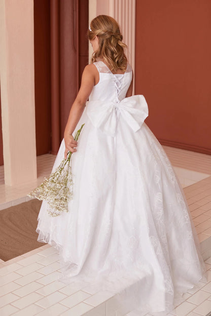An oversized bow sits above the off-white flower girl dress's lace train.