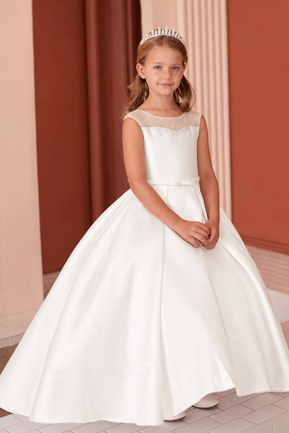 In view: a full pleated satin skirt of an off-white flower girl dress.