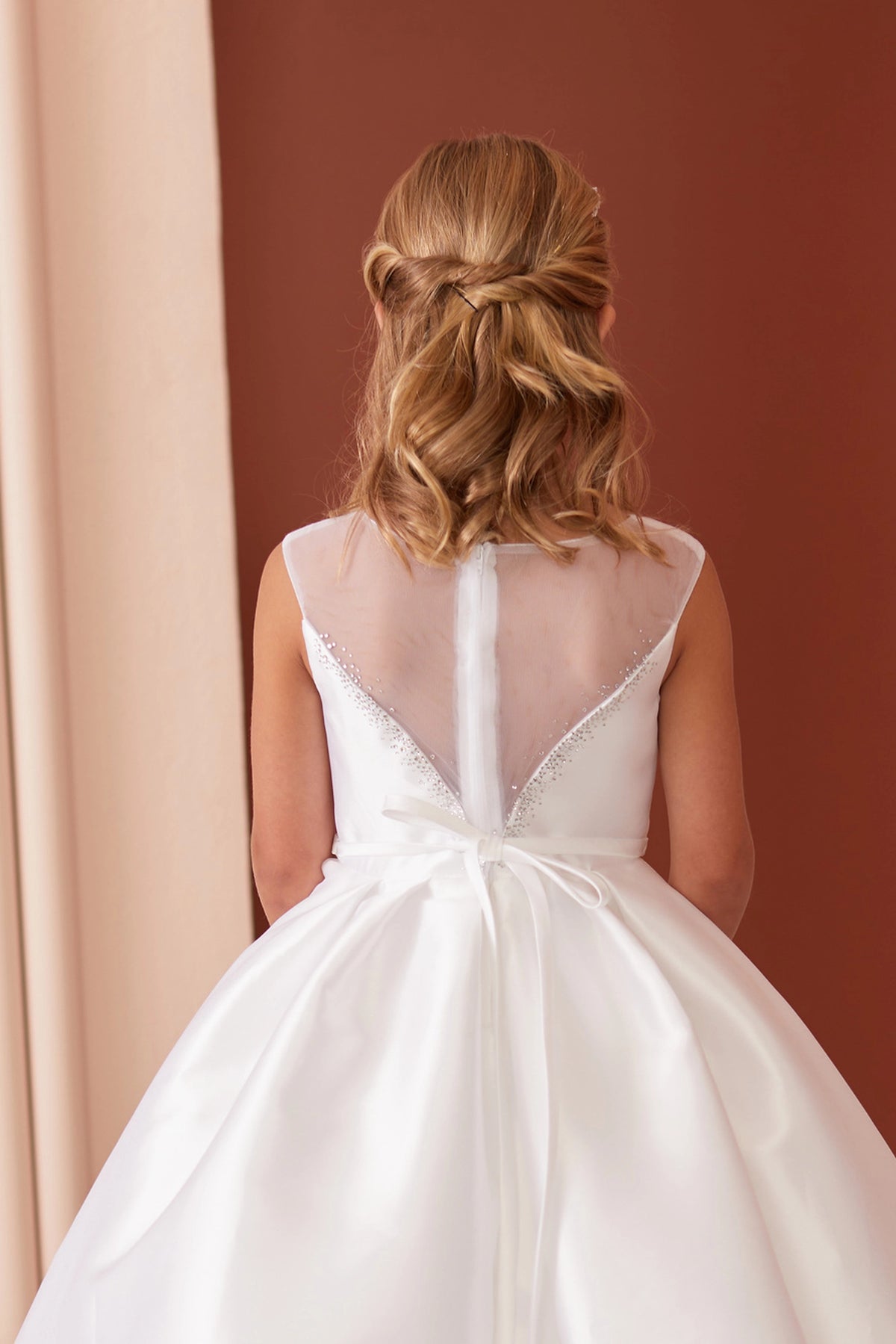 White flower girl dress with deep V back.