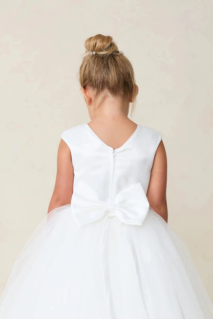 White flower girl dress detailed with a sculpted satin bow.