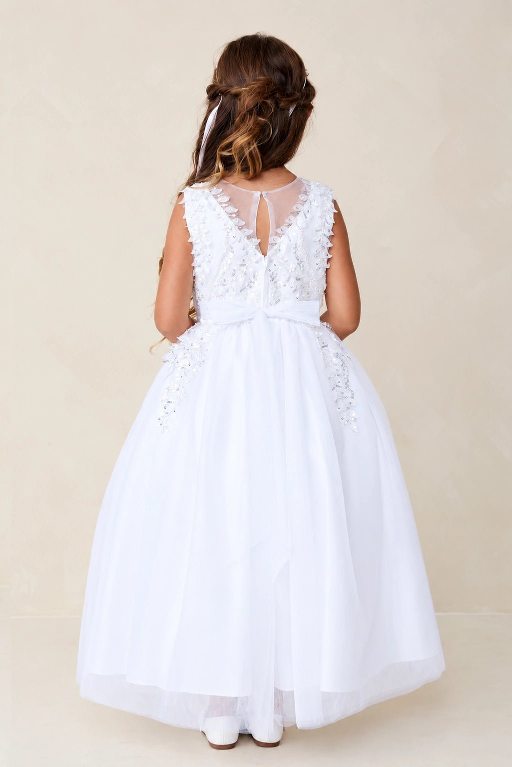 Sheer lace back shown on the white flower girl dress.