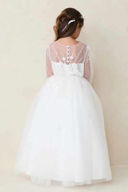 Buttoned sheer back on an off-white flower girl dress.