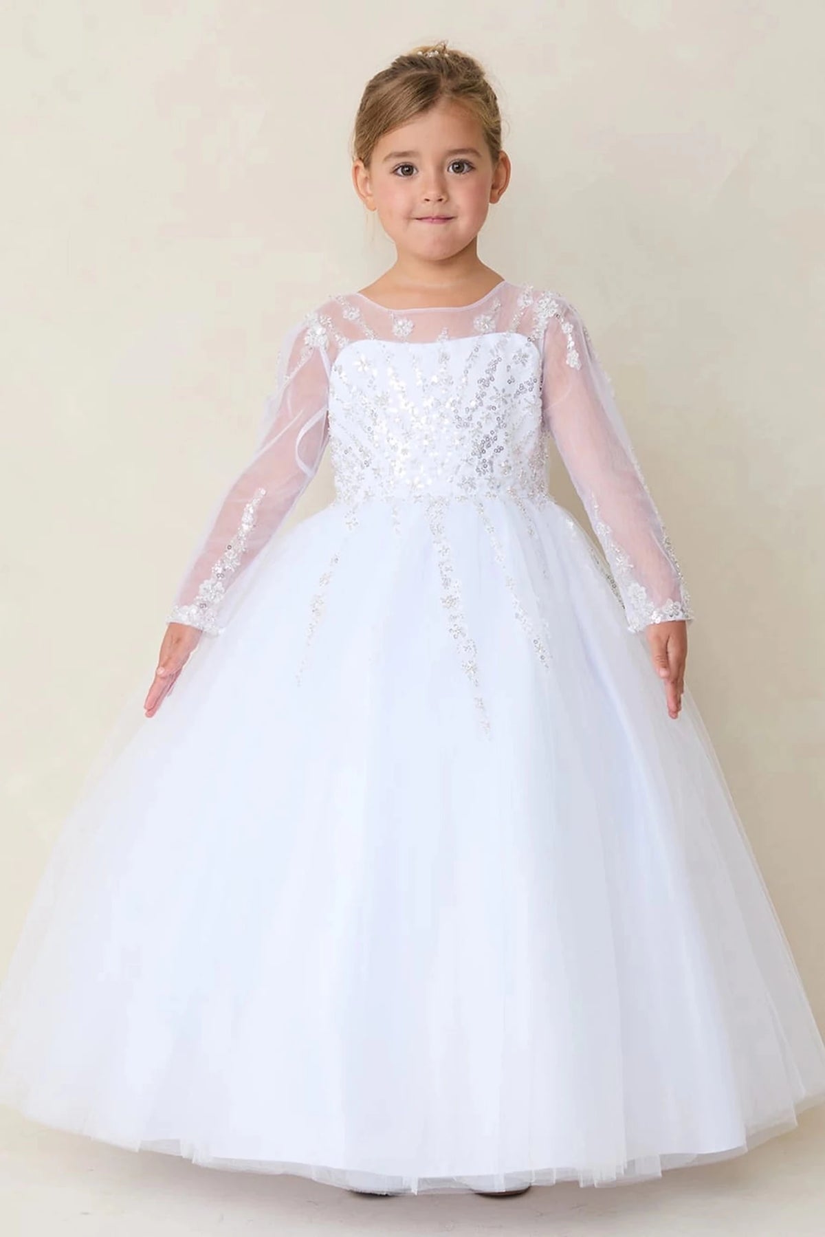 A view of sheer sequin sleeves on the white flower girl dress.