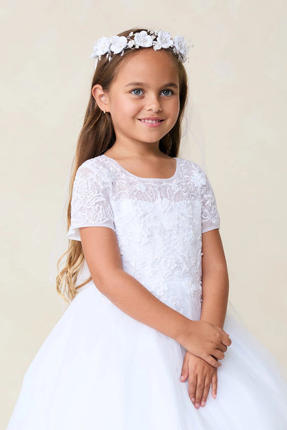 A view of a sheer floral neckline on the white flower girl dress.