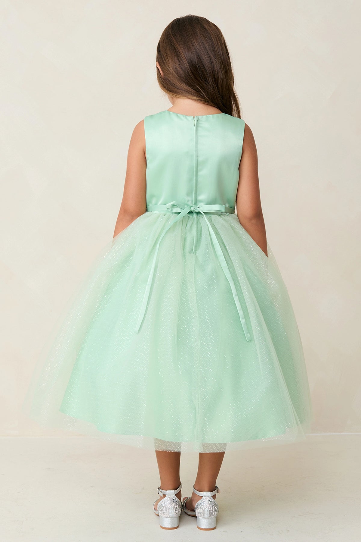 The Sage kids pageant dress has a tied sash across the back waist.