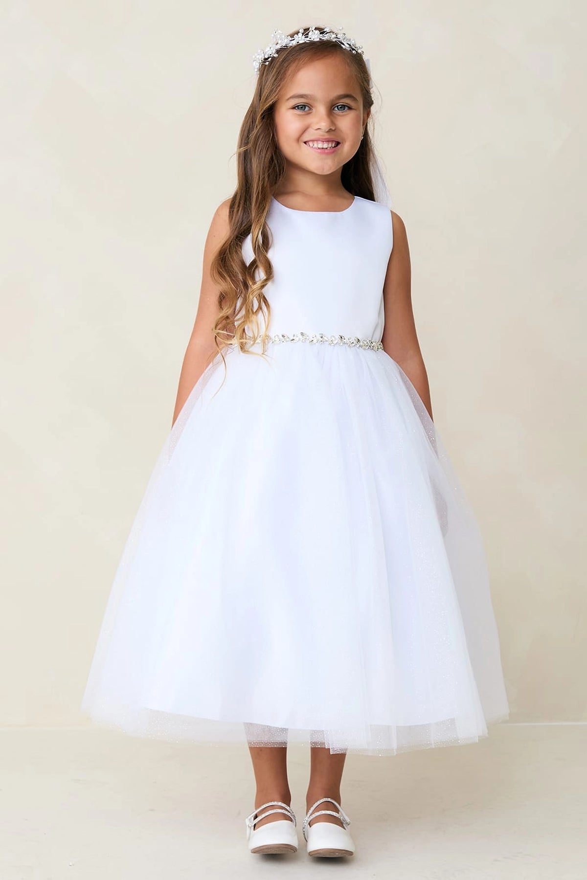 White kids pageant dress featuring a satin bodice and sparkling tulle skirt.