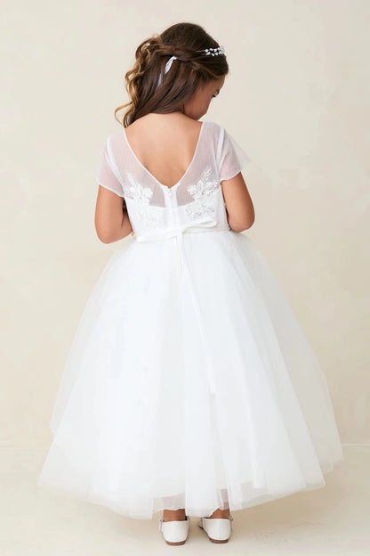 Emphasis on a small back bow of the off-white flower girl dress.